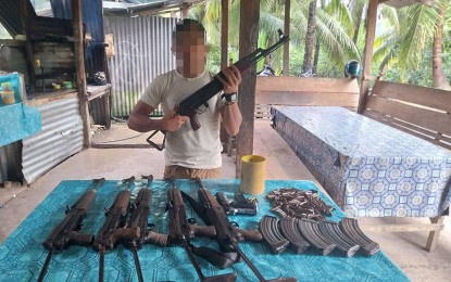 <p><strong>NPA FIREARMS.</strong> Jerome Amparo Marapao, an NPA medic of Platoon 2, Sub-Regional Sentro De Grabidad Sagay in Agusan del Norte led government troops on Thursday (Feb. 1, 2024) in the recovery of a cache of firearms hidden by the rebels in Barangay Sangay, Buenavista town. The armed encounters in Agusan del Norte last month also resulted in the death of four rebels, the capture of three, and the recovery of 14 high-powered firearms. <em>(Photo courtesy of 402Bde)</em></p>