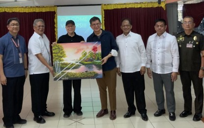 <p><strong>SUPPORT FOR INMATES.</strong> Bureau of Corrections Director General Gregorio Pio P. Catapang Jr. (2nd from left) and San Miguel Corporation president and chief executive officer, Ramon S. Ang (3rd from left) during a visit to the University of Perpetual Help System Dalta at the Medium Compound of the New Bilibid Prison in Muntinlupa City on Friday (Feb. 2, 2024). Ang committed to PHP150 million to the country's penal management system to boost efforts in preparing inmates for reintegration with the society through skills building. <em>(Photo courtesy of BuCor PIO)</em></p>