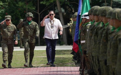 <p><strong>STRONG MILITARY</strong>. Speaker Ferdinand Martin G. Romualdez (3rd from left) salutes Philippine Army troops during his arrival at Camp Evangelista in Cagayan De Oro City on Wednesday (Feb. 7, 2024). Romualdez assured that the House of Representatives is committed to a strong, modern, well-equipped and well-cared for military establishment that would defend the country from internal and external threats.<em> (Photo courtesy of Speaker’s office)</em></p>