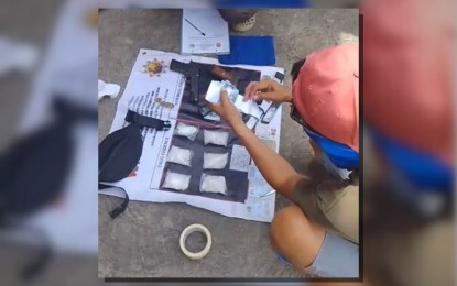 <p><br /><br /><strong>BUSTED.</strong> Police agents account for suspected shabu with an estimated street value of PHP2.4 million and firearms seized from two suspected drug peddlers during a drug sting in Crossing Simuay, Sultan Kudarat, Maguindanao del Norte on Thursday morning (Feb. 8, 2024). The police also seized the suspects’ black pick-up truck and their mobile phones.<em> (Photo courtesy of Sultan Kudarat MPS)</em></p>