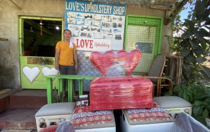 <p><strong>HANDIWORK</strong>. Alladin Villar shows off his beautiful pieces of custom-made sofa sets in his shop in Masbate town. A former bus driver plying the Masbate-Manila route, he gave up his job when the pandemic hit and travels were restricted, after securing a loan from a microfinance company, which enabled him to start his own upholstery business. <em>(PNA photo by Connie Calipay)</em></p>