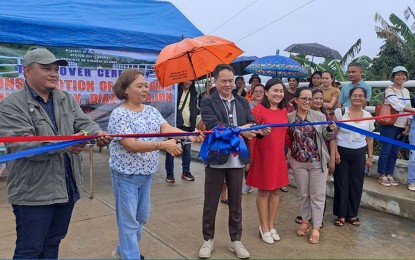 <p><strong>NEW BRIDGE.</strong> Dinagat Islands Gov. Nilo Demerey Jr. (center) is joined by former governor Arlene Bag-ao (2nd from left) during the turnover of the newly completed Maraging Bridge in Barangay Diaz, Tubajon on Thursday (Feb. 8, 2024). The completed bridge had a total budget of PHP14.7 million. <em>(Photo courtesy of Tubajon-MIO)</em></p>