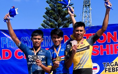 <p><strong>THREE-TIME CHAMPION.</strong> Jonel Carcueva (center) won the men's elite road race in the PhilCycling National Championships for Road 2024 in Tagaytay City on Friday (Feb. 9, 2024). Jericho Jay Lucero (left) was second and Ronald Lomotos, third. <em>(Photo courtesy of PhilCycling)</em></p>