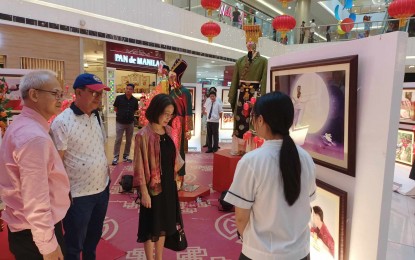 <p><strong>CHINESE CULTURE EXHIBIT.</strong> Consul General of the People's Republic of China in Cebu Zhang Zhen (3rd from left) views the cultural exhibit at SM City Iloilo on Thursday ( Feb.8, 2024). The exhibit which will run until Feb. 11 features 10 major festivals of China and is one of the activities lined up for the Chinese New Year. <em>(PNA photo by PGLena)</em></p>