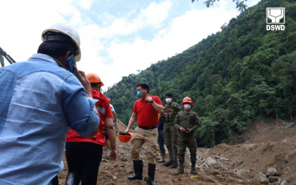 <p><strong>GROUND ZERO VISIT</strong>. Department of Social Welfare and Development (DSWD) Secretary Rex Gatchalian (with blue facemask) visits ‘ground zero’ or the landslide site in Barangay Masara in Maco, Davao de Oro on Sunday (Feb. 11, 2024). He commended the rescue teams for their hard work and determination to find more survivors. <em>(Photo courtesy of DSWD)</em></p>