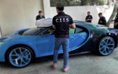 Owner yields smuggled blue Bugatti sports car to BOC