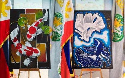 <p><strong>MASTERPIECES.</strong> Paintings made by inmates from the Dasmariñas City Jail Male Dormitory are on display in this Feb. 8, 2024 photo. The Department of the Interior and Local Government on Friday (Feb. 23, 2024) announced the launch of painting, handicraft-making, and songwriting competitions for PDLs nationwide to hone their skills and creativity.<em> (Photo courtesy of BJMP Dasmariñas City Jail Male Dormitory Facebook page)</em></p>