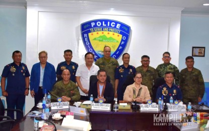 <p><strong>ENSURING PEACE.</strong> Commission on Elections chair George Erwin Garcia and Commissioner Aimee Ferolino (seated, 2nd and 3rd from left) lead a command conference with police and military officials at the Police Regional Office-Soccsksargen headquarters in General Santos City on Tuesday (March 5, 2024). They discussed security preparations for the April 13 plebiscite in the Bangsamoro Special Geographic Area in North Cotabato for the creation of eight towns. <em>(Photo courtesy of 6th Infantry Division)</em></p>