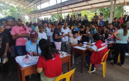 2K disaster-hit families in Davao Oriental get cash aid from DSWD