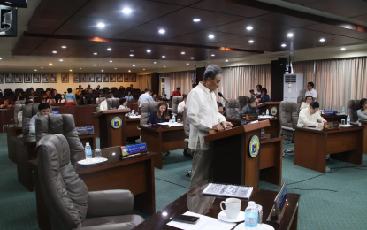 <p>Cagayan de Oro City Councilor Edgar Cabanlas (center) during a council session. <em>(File photo courtesy of CDO City Council)</em></p>