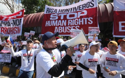 <p><strong>BELIEVERS.</strong> Supporters of religious leader Apollo Quiboloy hold a rally outside the Senate building in Pasay City on Tuesday (March 5, 2024). Senator Risa Hontiveros wants Quiboloy arrested for refusing to honor a Senate subpoena to attend a probe while the Department of Justice has ordered the filing of sexual abuse of a minor, child abuse and qualified human trafficking charges against the Kingdom of Jesus Christ founder. <em>(PNA photo by Avito Dalan)</em></p>