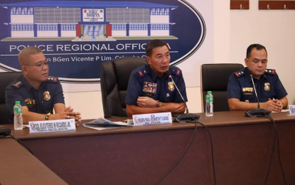 <p><strong>ZERO TOLERANCE</strong>. Brig. Gen. Paul Kenneth Lucas (center), director of the Calabarzon police, during a press briefing on March 6, 2024. On Wednesday (May 29, 2024) he ordered the relief of nine Quezon police officers over a home invasion incident<em>. (Photo courtesy of PRO4A)</em></p>