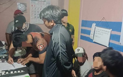 <p><strong>DRUG DEN.</strong> Philippine Drug Enforcement Agency agents arrested three men, seized suspected shabu, and dismantled an alleged drug den in Sibulan, Negros Oriental, Tuesday night (March 6, 2024). One of the suspects allegedly operated the supposed drug den while the two others were his "visitors". <em>(Photo courtesy of the PDEA Region 7)</em></p>