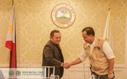 <p><strong>HEALTH CARE PARTNERS</strong>. DOH Undersecretary and concurrent Department of Health-Center for Health Development in Bicol (DOH-CHD-5) Regional Director Dr. Nestor Santiago Jr. (right) and Albay Governor Edcel Grex Lagman shake hands after signing the Terms of Partnership (ToP) for the Annual Operational Plan for 2024 as one of Universal Health Care Integration Sites (UHC IS) in the region on March 4, 2024. UHC IS aims to showcase the successful implementation of UHC's core principles, including equitable service delivery, access to essential health services and financial risk protection at the local level. <em>(Photo courtesy of DOH-Bicol)</em></p>