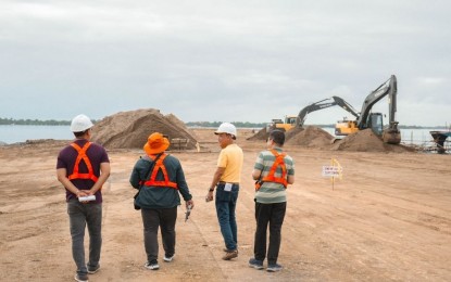 <p><strong>CAUSEWAY.</strong> Officials inspect the ongoing work of the PHP4.58 billion Tacloban causeway project on Feb. 27, 2024. The project will provide a shorter route from the city’s downtown to the airport. <em>(Photo courtesy of Department of Public Works and Highways)</em></p>