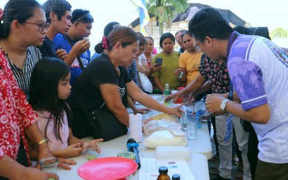 <p><strong>CANDLE-MAKING.</strong> In time for Davao de Oro's 26th founding anniversary, the Technical Education and Skills Development Authority (TESDA) joins the caravan of services on Thursday (March 7, 2024) to teach candle-making to the residents of Davao de Oro at the provincial capitol in Nabunturan town. The provincial government conducted a job fair and caravan of services with some 14 government agencies as part of its founding anniversary celebration. <em>(PNA photo by Robinson Niñal Jr.)</em></p>