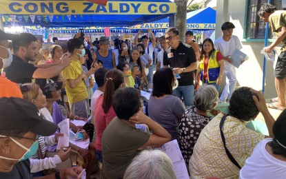 <p><strong>FREE HEALTH CARE SERVICES</strong>. Ako Bicol Party-list (AKB) Representative Raul Angelo Bongalon talks with senior citizens waiting to be called during the one-day medical-dental mission dubbed "Tarabangan Caravan" in Barangay Jonop, Malinao, Albay on Friday (March 8, 2024). The activity is only a part of the series of medical and dental missions that are already scheduled by the party-list throughout the Bicol region.<em> (Photo by Connie Calipay)</em></p>