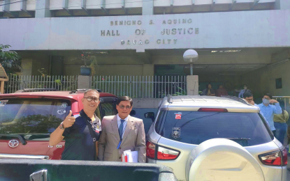 <p><strong>ACQUITTED.</strong> Sotero Jacolbe Jr. (left) and his legal counsel, Attorney Vicente Andiano, leave the Regional Trial Court in Davao City on Friday (March 8, 2024). The court cleared Jacolbe of charges of murder over the slaying of radio broadcaster Eduardo Dizon in Kidapawan City in 2019. <em>(Photo grabbed from Jacolbe Jr. FB Page)</em></p>