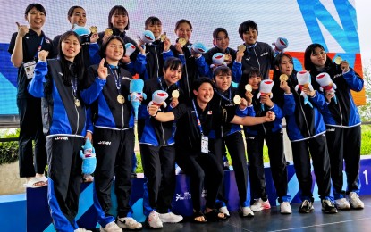 <p><strong>CHAMPIONS.</strong> The Japanese women's water polo team, with head coach Tsubasa Mori (front row, center), pose with their gold medals during the awarding ceremony of the 11th Asian Age Group Championships at New Clark City Aquatics Center in Capas, Tarlac on Saturday (March 9, 2024). The Japanese won all their six matches.<em><strong> (AAGC photo)</strong></em></p>