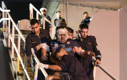 <p><strong>SURVIVORS.</strong> Crew members of bulk carrier MV True Confidence disembark at Djibouti port after their rescue by Indian warship INS Kolkata on March 6, 2024. Two Filipinos and a Vietnamese were killed after the Houthi missile attack in the Gulf of Aden.<em> (Photo courtesy of Djibouti Ports Authority X account)</em></p>