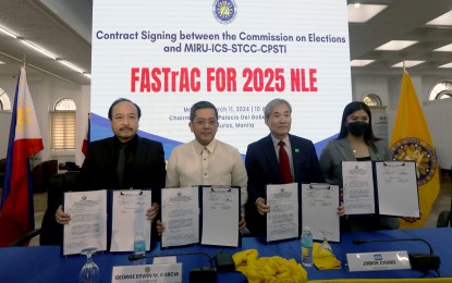 <p><strong>POLL AUTOMATION.</strong> Commission on Elections Chairman George Erwin Garcia (2nd from left) and Miru Systems president Jinbok Chung (3rd from left) show the signed contract for the automated voting system to be used in 2025 national and local elections at the Comelec main office in Intramuros, Manila on March 11, 2024. Former Caloocan City Rep. Edgar Erice on Thursday (April 18) asked the Supreme Court to issue a temporary restraining order against the implementation of the PHP18-billion contract. <em>(PNA photo by Yancy Lim)</em></p>