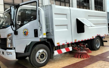 <p><strong>MODERN CLEANER.</strong> The vacuum sweeper truck acquired by the Iloilo City government is presented to city hall employees on Monday (March 11, 2024). It will be deployed to areas without street sweepers. <em>(PNA photo by PGLena)</em></p>
<p><span data-preserver-spaces="true"><strong> </strong></span></p>
<p> </p>