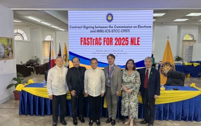<p><strong>POLL AUTOMATION DEAL.</strong> Commission on Elections (Comelec) officials headed by Chairman George Garcia (third from left) lead the signing of the contract for the Full Automation System with Transparency Audit/Count (FASTrAC) project worth over PHP17 billion for the 2025 midterm polls at the Comelec main office in Intramuros, Manila on Monday (March 11, 2024). South Korean firm Miru Systems bagged the project's contract. <em>(PNA photo by Ferdinand Patinio)</em></p>
