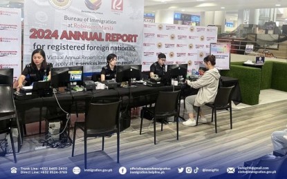 <p><strong>ANNUAL REPORT. </strong>Bureau of Immigration personnel man an annual report venue inside a mall in this undated photo. The BI on Monday (March 11, 2024) said Chinese nationals topped the list of foreigners who signed up for this year's annual report.<em> (Photo courtesy of BI)</em></p>