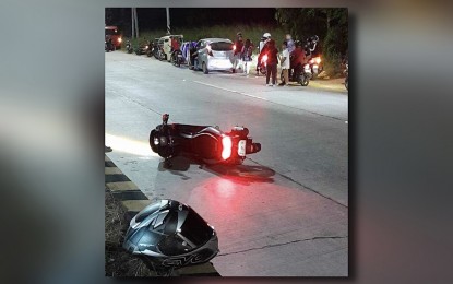 <p><strong>GUNNED DOWN.</strong> The crash helmet and motorbike of Cpl. Ricky Mendoza Gomez, a police intelligence officer from North Cotabato, after he was ambushed in General Santos City on Sunday night (March 10, 2024). Gomez died on the spot due to multiple gunshot wounds. <em>(Photo courtesy of Gen. Santos CPO)</em></p>