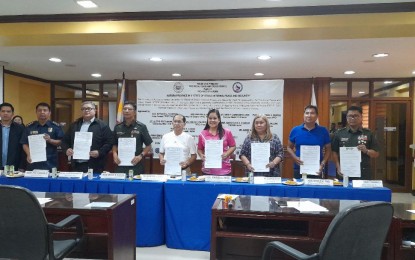 <p><strong>PEACE AND SECURITY DECLARATION</strong>. Aurora Acting Governor Reynante Tolentino (in white shirt) is shown together with other government officials after the signing of a resolution declaring the province of Aurora under a state of stable internal peace and security in Baler town on Wednesday (March 13, 2024). This was after the Department of the Interior and Local Government declared that 15 villages in two municipalities were cleared of insurgency influence<em>. (Photo by Jason de Asis) </em></p>
