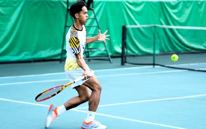 <p><strong>WINNER. </strong>University of Santo Tomas player EJ Tangub makes a forehand return to Ateneo's Austin delos Santos during the UAAP Season 86 men's tennis tournament at the Felicisimo Ampon Tennis Center inside the Rizal Memorial Sports Complex in Manila on March 13, 2024. Tagub won, 6-2, 6-1. <em>(UAAP photo) </em></p>