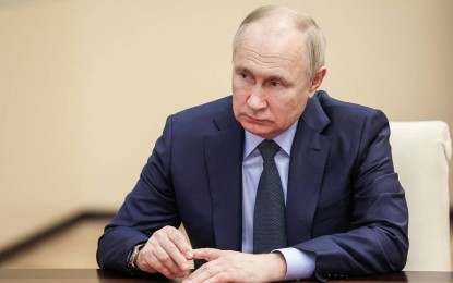 Putin calls on Russians to take part in presidential polls
