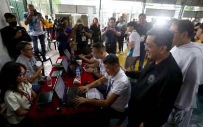 <p><strong>LURING MORE VOTERS.</strong> Commission on Elections chairperson George Erwin Garcia (right) leads the poll body's voter education and registration fair at the University of Santo Tomas in Manila on Thursday (March 14, 2024). The poll body is keen on tapping malls as voting sites for the 2025 midterm elections. <em>(PNA photo by Yancy Lim)</em></p>