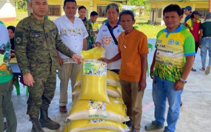<p><strong>‘RAMADAN RICE’.</strong> Lawyer Suharto Ambolodto (2nd left) and Army Lt. Colonel Udgie Villan, commander of the Army's 33rd Infantry Battalion, join members of Al-Qhalid Farmers Marketing Cooperative during the launching of "Ramadan rice" which is part of the Bigasang Bangsamoro Magsasaka (BBM) project under the Bagong Pilipinas program of the national government. The Ramadan rice is being sold in Mamasapano at PHP45 per kilo or PHP1,125 per half sack (25 kilos). <em>(Photo courtesy of Bangsamoro Parliament Member Suharto Ambolodto)</em></p>
