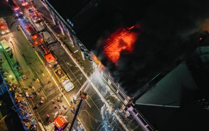 <p><strong>GUTTED.</strong> Firefighters try to suppress the blaze that gutted two three-story buildings in portions of Iloilo City’s Chinatown on Iznart Street and Calle Real Friday night (March 15, 2024). The fire that left PHP8.08 million worth of damage was declared out after nine hours. <em>(Photo courtesy of MORE Power)</em></p>
<p> </p>
<p> </p>