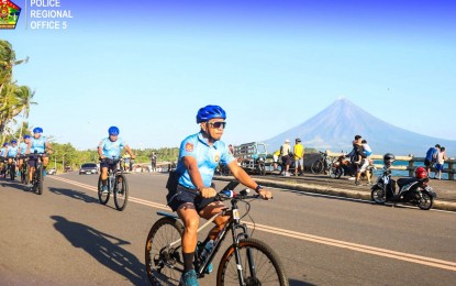 <p><strong>POLICE VISIBILITY.</strong> Police Regional Office Bicol personnel conduct bicycle patrols on Legazpi Boulevard, Legazpi City, Albay to ensure the safety of residents while enjoying family activities. The Philippine National Police said Monday (March 18, 2024) it will deploy additional police personnel to ensure the safety and security of the public during Holy Week and summer vacation.<em> (Photo courtesy of PRO5)</em></p>
