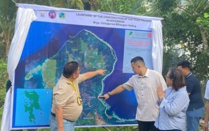 <p><strong><span data-preserver-spaces="true">NEW ROAD.</span></strong> 4Ps Partylist Rep. Marcelino Libanan (left) and other officials point to the location of the proposed circumferential road in Homonhon Island in Guiuan, Eastern Samar during the launch on Sunday (March 17, 2023). The historic island is getting PHP100 million this year to build the long-planned project. <em>(PNA photo by Lizbeth Ann Abella)</em></p>