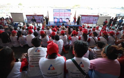 <p><strong>EMERGENCY EMPLOYMENT.</strong> Senator Ramon Revilla Jr. (at the podium) speaks before 900 beneficiaries of the emergency employment program of the Department of Labor and Employment (DOLE) at the Freedom Grandstand in Iloilo City on Thursday (March 21, 2024). Gabriel Felix Umadhay, Public Employment Service Office (PESO) manager for Iloilo City, in an interview on Friday (March 22, 2024) said the emergency employment has helped sustain Iloilo City’s cleanup campaign.<em> (Photo courtesy of Arnold Almacen/City Mayor’s Office)</em></p>