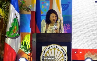 <p><strong>WOMEN IN TRAVEL.</strong> Department of Tourism Secretary Christina Garcia Frasco delivers a message during the opening of the three-day Pacific Asia Travel Association (PATA) International Conference on Women in Travel in Panglao, Bohol on Thursday (March 21, 2024). The DOT has a six-year Gender and Development Agenda to eliminate discrimination and achieve gender parity in the tourism sector. <em>(Screenshot from DOT video)</em></p>