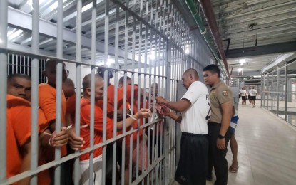 <p><strong>TRANSFER.</strong> Inmates are processed during their transfer from the New Bilibid Prison in Muntinlupa to Davao Prison and Penal Farm (DPPF) in Davao Del Norte in this photo taken March 16, 2024. The transfer is part of the continuing master decongestion plan of the Bureau of Corrections. <em>(Photo courtesy of Bucor)</em></p>