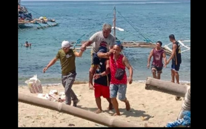 <p><strong>RESCUED</strong>. Twenty-three fishermen were rescued from a burning fishing vessel off the coast of Basay, Negros Oriental on Thursday (March 22, 2024). The police on Friday said engine failure due to overheating had ignited the fire and caused the vessel to sink.<em> (Photo courtesy of the Negros Oriental Police Provincial Office)</em></p>
