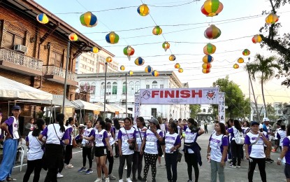 <p><strong>RUN FOR A CAUSE</strong>. Members of the Pantawid Pamilyang Pilipino Program (4Ps) gather in front of the Laoag City Hall on Friday (March 22, 2024) for a fun run for a cause. The event aims to help poor families be provided with solar panels. <em>(Photo by Leilanie Adriano)</em></p>