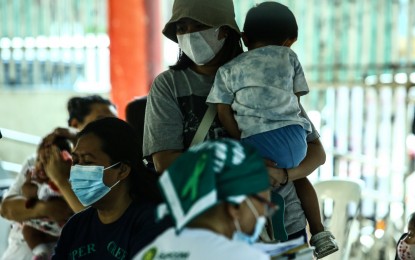 <p><strong>CURBING PERTUSSIS.</strong> Mothers bring their children for pentavalent vaccination at a health center in Barangay Pinyahan, Quezon City on March 22, 2024. Department of Health (DOH) spokesperson Albert Domingo said on Tuesday (April 23, 2024) said there are 19 cases of pertussis with two confirmed deaths in Quezon City as of April 13. <em>(PNA file photo by Joan Bondoc)</em></p>