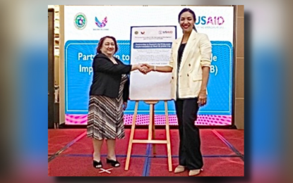 <p><strong>AGREEMENT.</strong> Department of Health current Chief of Staff Undersecretary Lilibeth David (left) with USAID Deputy Administrator Paloma Adams-Allen at the ceremonial signing of a PHP1.15-billion partnership to fight tuberculosis at the TB Active Case Finding Summit in Manila on March 21, 2024. The World Health Organization’s 2023 Global TB Report estimates that 106 Filipinos die of TB every day. <em>(Photo courtesy of US Embassy in Manila)</em></p>