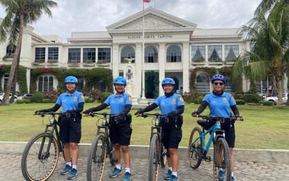 <p><strong>AT YOUR SERVICE</strong>. The all-women tourist police bike patrollers prepare for deployment in front of the Ilocos Norte Capitol in this undated photo. Ilocos Norte Provincial Police Office Director PCol. Frederick Obar said additional 100 cops from the region were deployed to ensure peaceful observance of the Holy Week. <em>(Photo courtesy of the INPPO)</em></p>