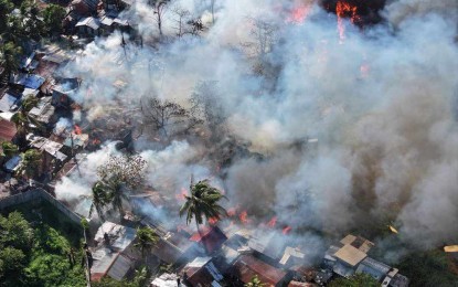 <p><span data-preserver-spaces="true"><strong>AID.</strong> A fire engulfs a residential area in Barangay Airport in Mandurriao district on March 5, 2024. The Department of Human Settlements and Urban Development (DHSUD) ordered its regional office in Western Visayas to validate the number of families affected by fire incidents for the provision of financial assistance under the Integrated Disaster Shelter Assistance Program (IDSAP). (<em>Photo courtesy of CDRRMO</em>)</span></p>