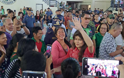 <p><strong>AIDING THE VULNERABLE</strong>. Senator Imee Marcos waves to the crowd during the distribution of government cash aid at the municipal gymnasium of Carmen, North Cotabato, on Sunday afternoon (March 24, 2024). Each of the 5,000 beneficiaries received PHP2,000 each.<em> (PNA photo by John Andrew Tabugoc)</em></p>