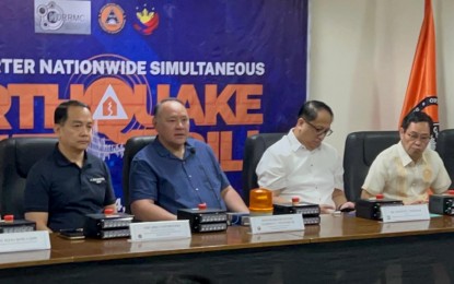 <p><strong>READY FOR THE 'BIG ONE'.</strong> DND Secretary Gilberto Teodoro Jr. speaks during the 1st Quarter National Simultaneous Earthquake Drill (NSED) at Camp Aguinaldo, Quezon City on Monday (March 25, 2024). He said the quarterly National Simultaneous Earthquake Drill (NSED) aims to enhance the "conditioned response" of Filipinos for sudden tremblors and other disasters.<em> (Photo courtesy of PTV)</em></p>