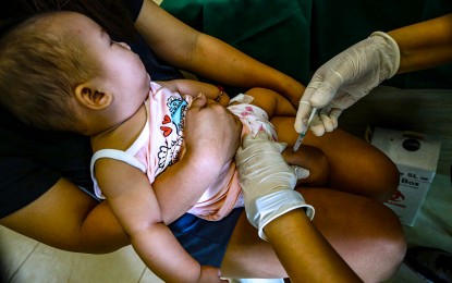 <p><strong>5-IN-1.</strong> A toddler receives the pentavalent vaccine, which will protect her against diptheria, tetanus, pertussis, influenza type B and hepatitis B, at a health center in Barangay Pinyahan, Quezon City on Friday (March 22, 2024). The local government has declared an outbreak of pertussis (whooping cough) after 23 cases and four deaths, mostly infants, from January to March 20. <em>(PNA photo by Joan Bondoc)</em></p>