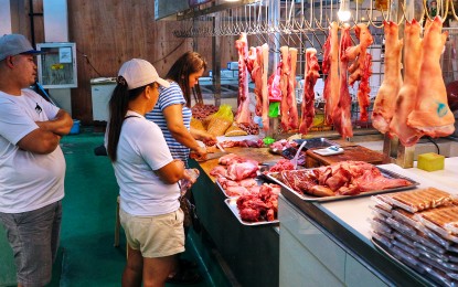 <p><strong>WIDENING GAP</strong>. Pork is sold from PHP330 to PHP380 per kilo at Agdao Public Market in Davao City on March 19, 2024. According to the Philippine Chamber of Agriculture and Food, the farmgate price of pig for slaughter ranged only between PHP140 and PHP160 per kilo. <em>(PNA photo by Robinson Niñal Jr.)</em></p>